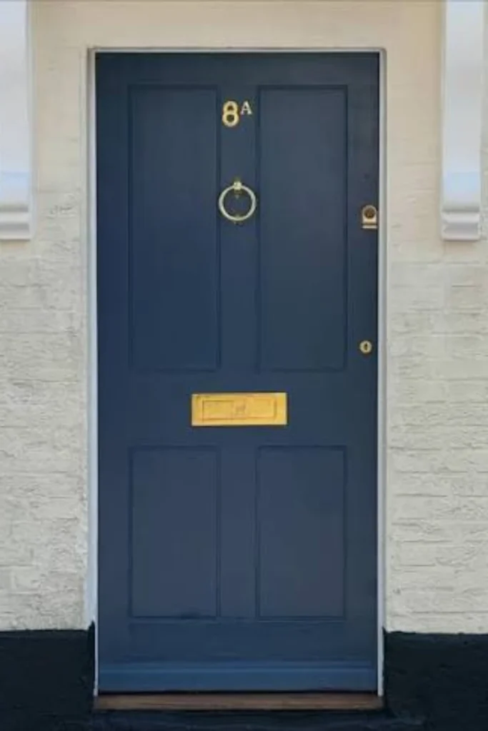 the Blue Door with Brass Hardware