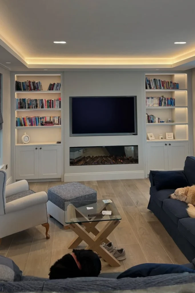 Full Height Bookcase TV Wall with TV Centered Among Open Shelves Styled to Glow the Full Height Bookcase TV Wall with TV Centered Among Open Shelves