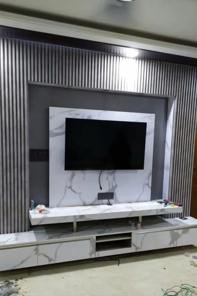 Luxury Marble Slab Behind TV with Vertical Walnut Wood Paneling Styled to Glow the Luxury Marble Slab Behind TV with Vertical Walnut Wood Paneling