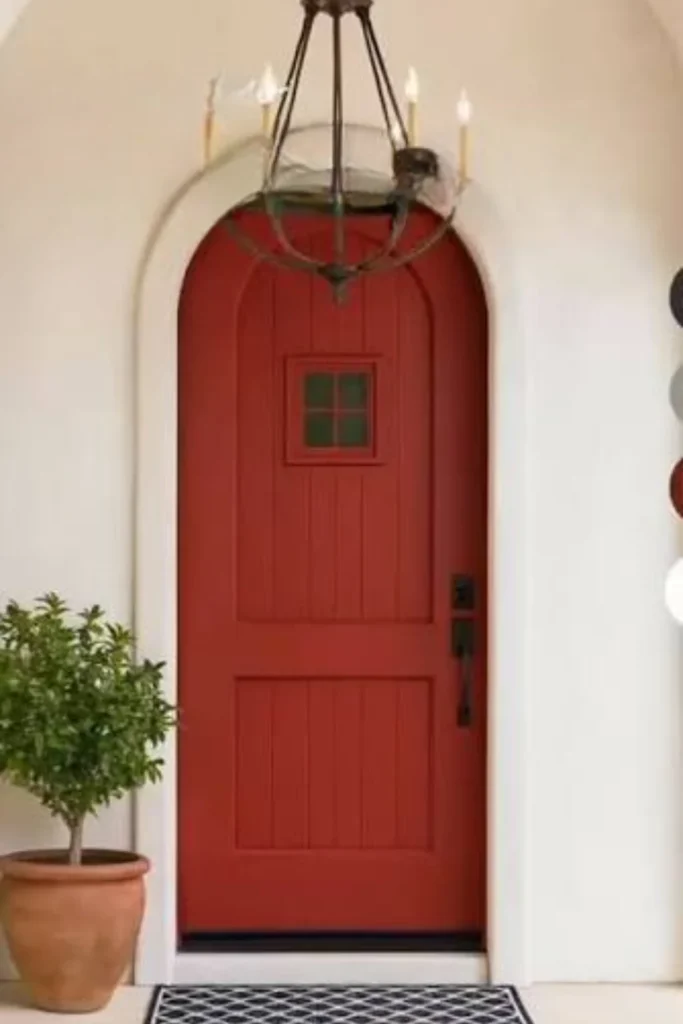 Red Arched Door with Ivory Stucco Surround Styled to Glow the Red Arched Door with Ivory Stucco Surround
