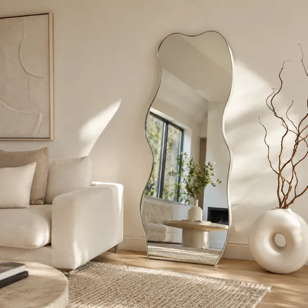 Wavy Edge Organic Floor Mirror in a Neutral Room Styled to Glow the Wavy Edge Organic Floor Mirror in a Neutral Room